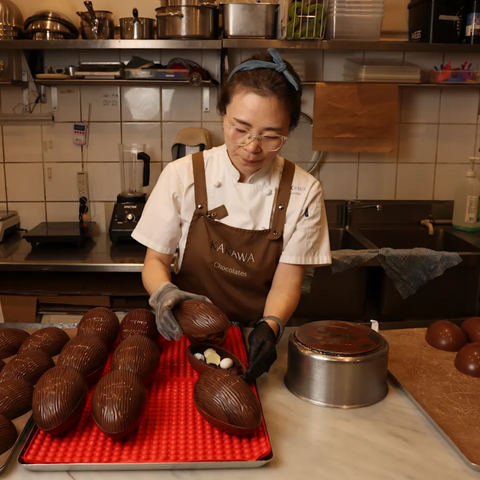 Jin Sun Kim, owner at Kakawa Chocolates, making Easter eggs at her shop in Darlinghurst. Louise Kennerley